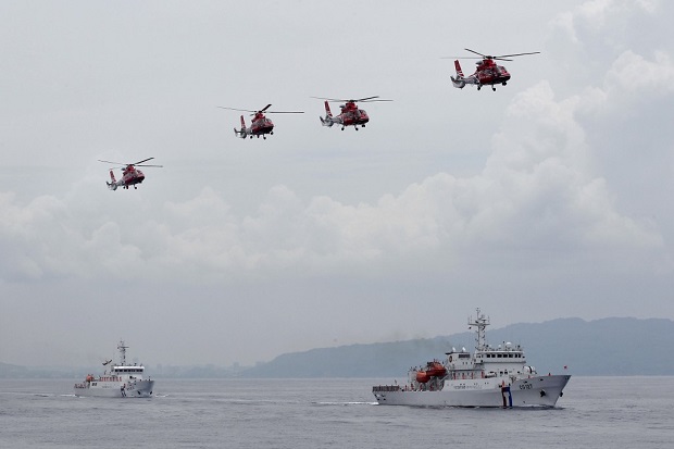 Ilustrasi kapal-kapal coast guard China. Kapal coast guard China dan kapal militer Malaysia berseteru di Laut China Selatan. Foto/REUTERS/Pichi Chuang
