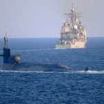 Kapal selam bertenaga nuklir Angkatan Laut Amerika Serikat, USS Georgia, muncul di Selat Hormuz yang dekat dengan wilayah Iran, Senin (21/12/2020). Foto/MCS2 Indra Beaufort/US Navy